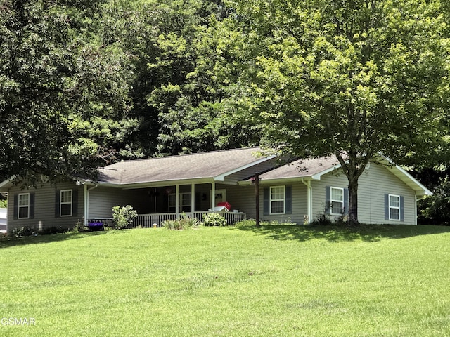 2865/2869 Happy Hollow Rd, Sevierville, TN 37862 - single story home featuring a front lawn, a porch, and roof with shingles