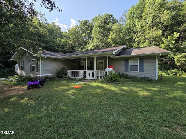 2865/2869 Happy Hollow Rd, Sevierville, TN 37862 - ranch-style house featuring a porch and a front yard
