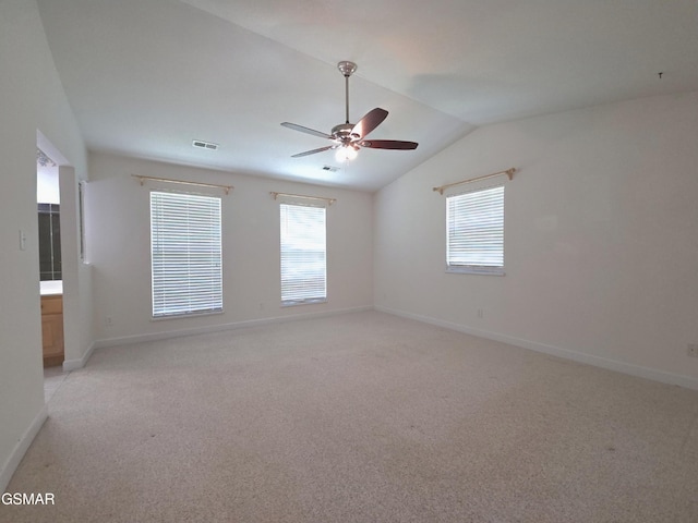 2865/2869 Happy Hollow Rd, Sevierville, TN 37862 - empty room featuring vaulted ceiling, a ceiling fan, light carpet, and plenty of natural light