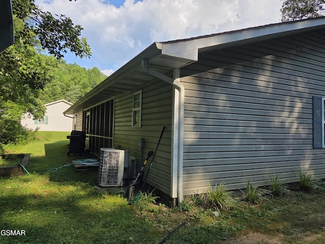 2865/2869 Happy Hollow Rd, Sevierville, TN 37862 - view of side of property featuring a central air condition unit and a yard