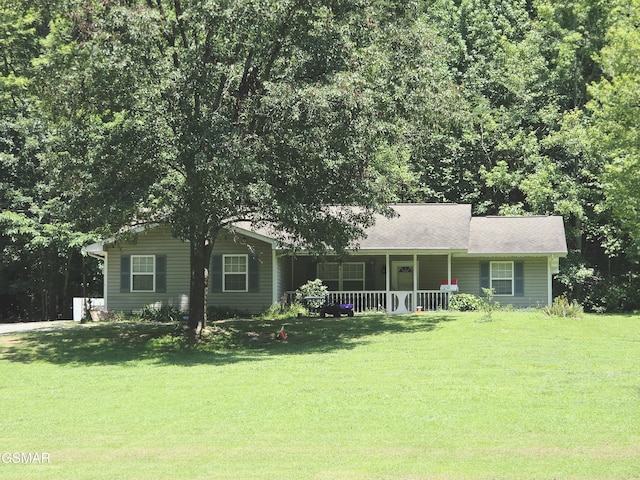 2865/2869 Happy Hollow Rd, Sevierville, TN 37862 - view of front of house featuring covered porch, a front yard, and a shingled roof