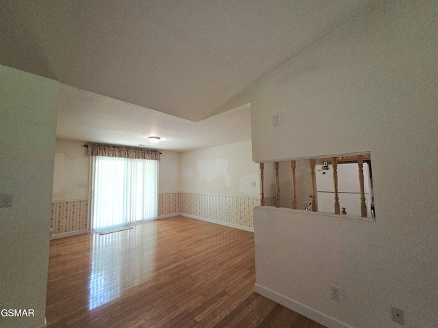 2865/2869 Happy Hollow Rd, Sevierville, TN 37862 - spare room featuring wood finished floors and a wainscoted wall