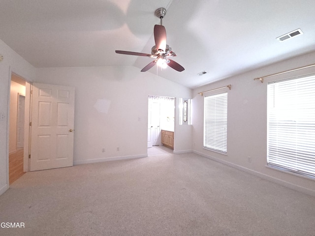 2865/2869 Happy Hollow Rd, Sevierville, TN 37862 - unfurnished bedroom with vaulted ceiling, light colored carpet, ensuite bathroom, and a ceiling fan