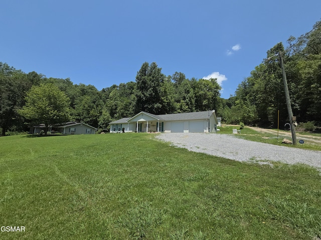 2865/2869 Happy Hollow Rd, Sevierville, TN 37862 - view of front of home featuring a garage, a front yard, and driveway