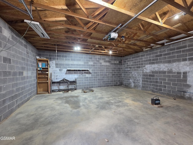 2865/2869 Happy Hollow Rd, Sevierville, TN 37862 - garage featuring a garage door opener and concrete block wall