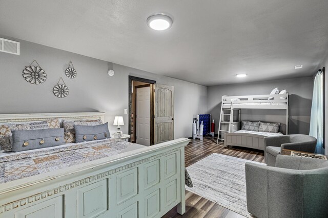 laundry room with separate washer and dryer, cabinets, and light wood-type flooring