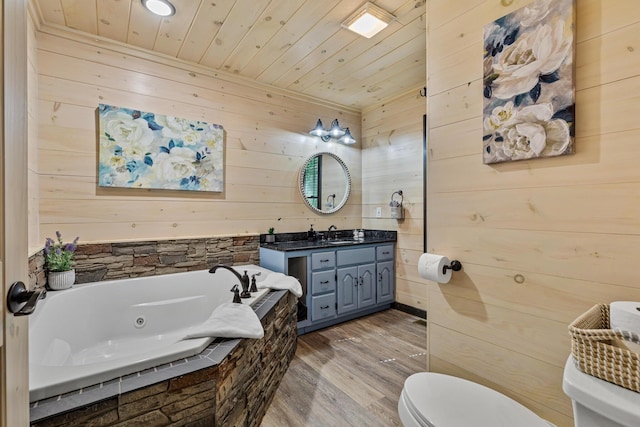 bathroom with wood-type flooring, wooden walls, and toilet