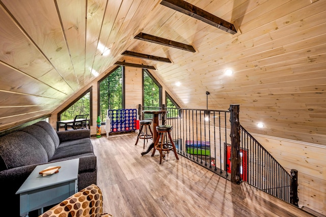 bonus room featuring vaulted ceiling with beams, wood ceiling, wood-type flooring, and wooden walls