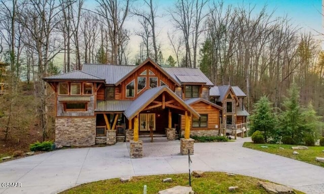 2716 Dayne Dr, Sevierville, TN 37862 - view of front of house with stone siding, metal roof, and concrete driveway