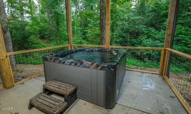 2716 Dayne Dr, Sevierville, TN 37862 - view of patio / terrace with a hot tub and a view of trees