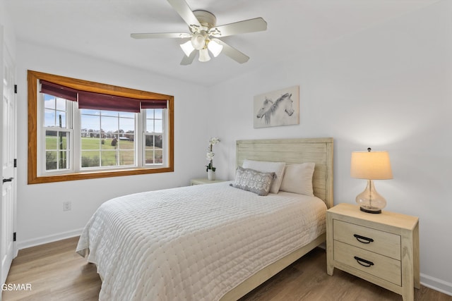 bedroom featuring light wood-type flooring and ceiling fan