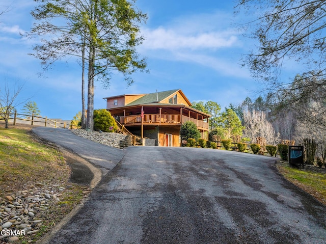 exterior space featuring a wooden deck