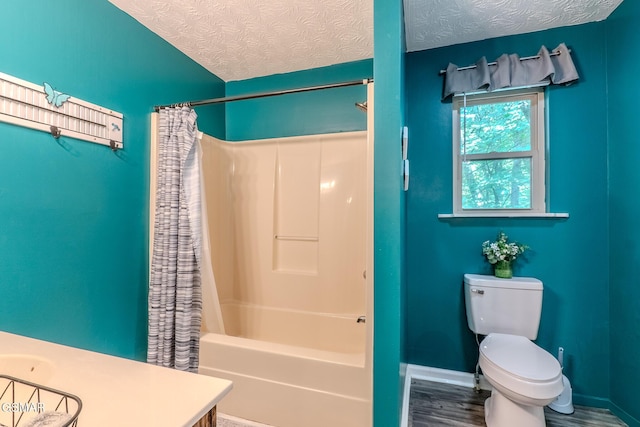 3078 Winding Way, Cosby, TN 37722 - bathroom with vanity, shower / bath combination with curtain, wood finished floors, and a textured ceiling