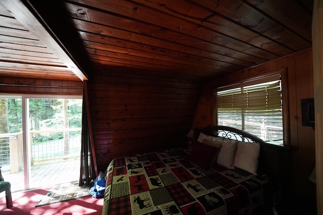 bedroom with wood walls, access to exterior, and wood ceiling