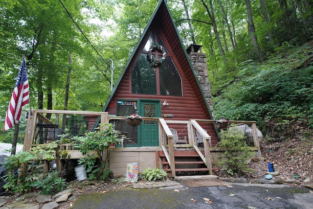 view of front of property with a wooden deck