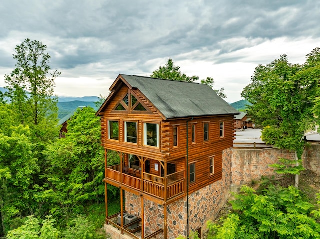 rear view of house with a mountain view