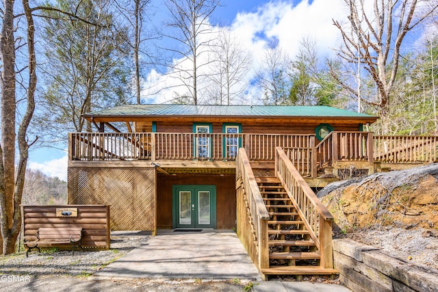 exterior space with french doors and a deck