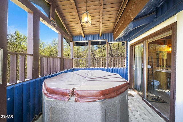 1023 Twin Oaks Rd, Gatlinburg, TN 37738 - sunroom / solarium featuring beam ceiling, a hot tub, and plenty of natural light