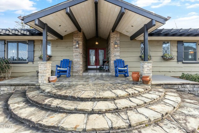 property entrance with french doors and a porch