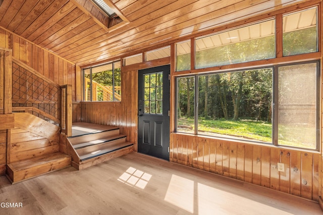 interior space featuring wooden ceiling and a skylight