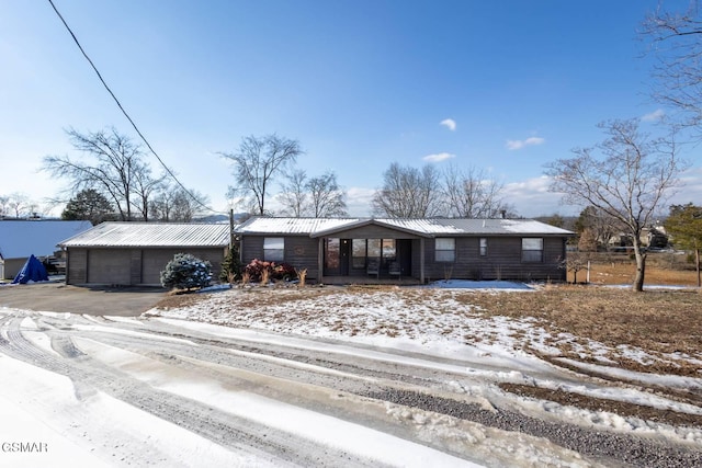 1369 Paradise Ln, Dandridge, TN 37725 - single story home featuring a garage, asphalt driveway, and a metal roof