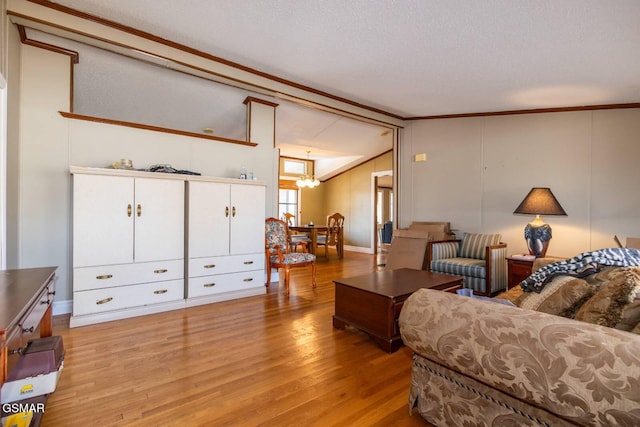 1369 Paradise Ln, Dandridge, TN 37725 - living area with light wood finished floors, a chandelier, ornamental molding, and a textured ceiling