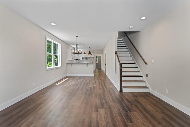 174 W Meeting St, Dandridge, TN 37725 - unfurnished living room featuring a chandelier and dark hardwood / wood-style flooring