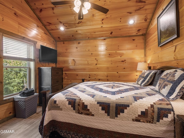 519 Edgewood Dr, Gatlinburg, TN 37738 - bedroom with lofted ceiling, light wood-style floors, wood ceiling, ceiling fan, and wooden walls