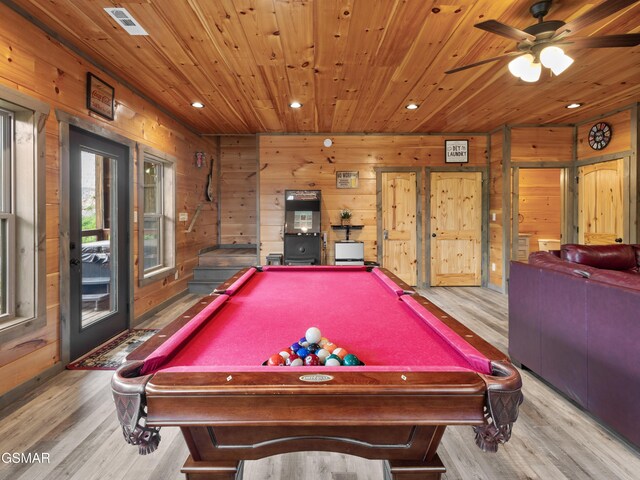 game room featuring wood walls, billiards, and light hardwood / wood-style flooring