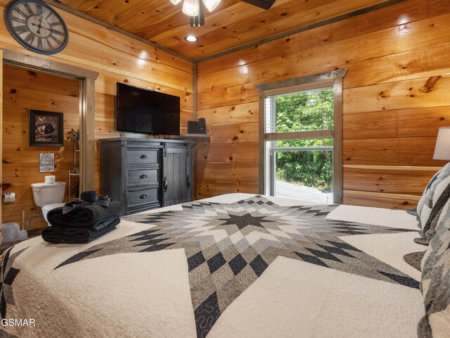 bedroom with wood walls and wood ceiling