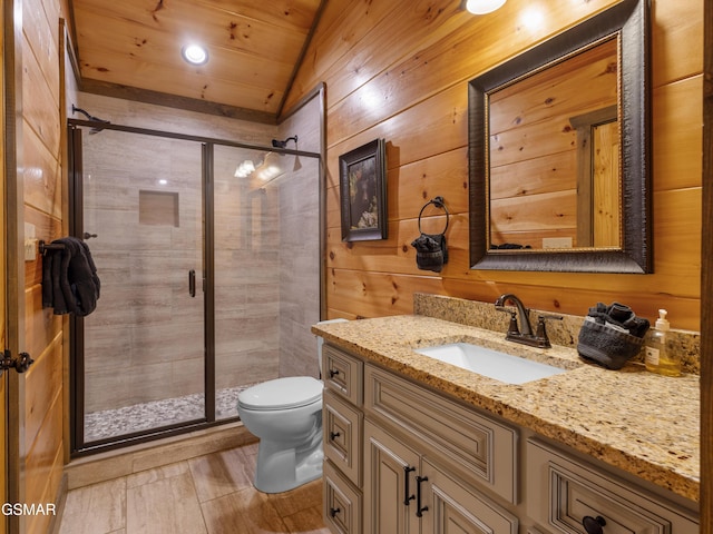 519 Edgewood Dr, Gatlinburg, TN 37738 - full bath with a stall shower, wood walls, vanity, and toilet