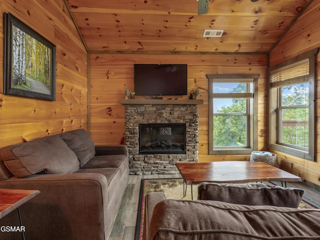 living room with wood-type flooring, vaulted ceiling, and wooden ceiling