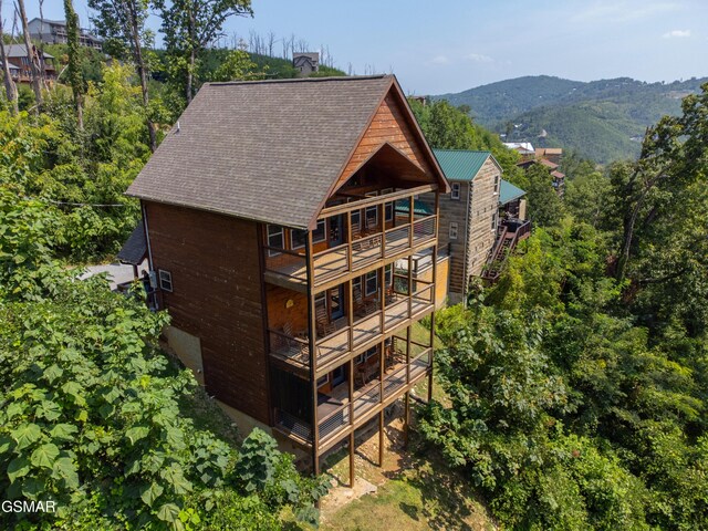 back of house with a balcony