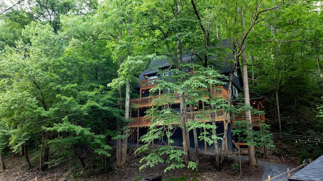 exterior space featuring a view of trees