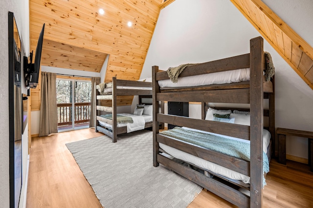 bedroom with lofted ceiling, access to outside, wood finished floors, and wood ceiling