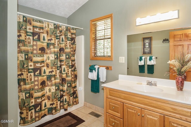 full bath featuring visible vents, tile patterned floors, curtained shower, a textured ceiling, and vanity