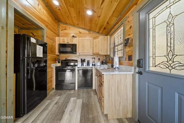 kitchen with lofted ceiling, light brown cabinetry, wood ceiling, a sink, and black appliances