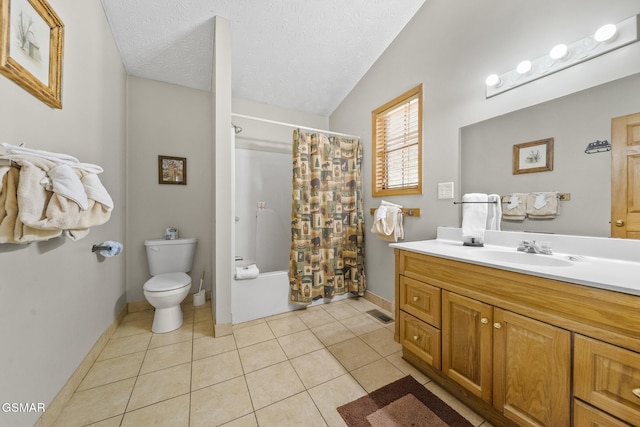 full bathroom featuring toilet, lofted ceiling, tile patterned floors, a textured ceiling, and vanity