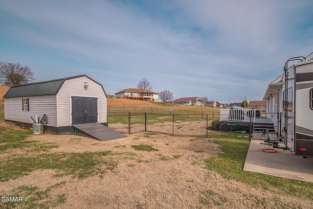 view of yard with a patio and a storage shed