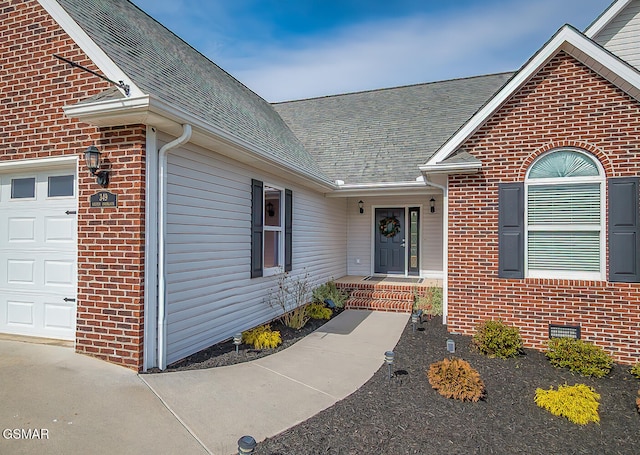 entrance to property featuring a garage