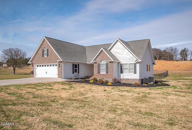 view of front of property with cooling unit and a front lawn