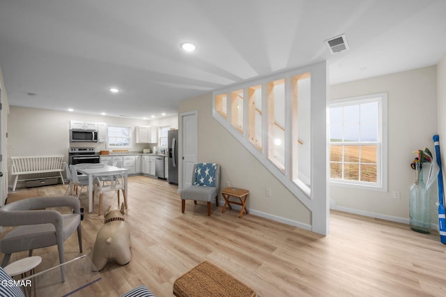 living room featuring light wood-type flooring