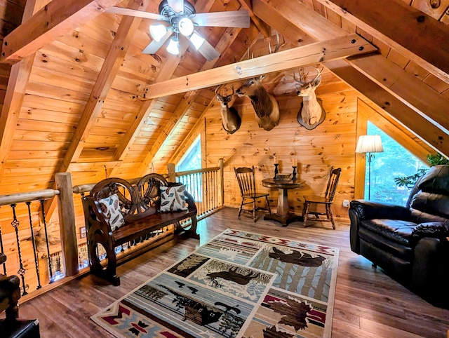 bedroom featuring multiple windows, wood walls, wooden ceiling, and wood-type flooring