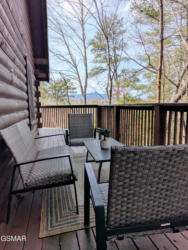 wooden terrace with a mountain view