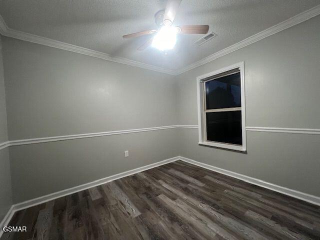 734 Southview Cir, Kodak, TN 37764 - unfurnished room featuring ceiling fan, dark wood-style floors, baseboards, and ornamental molding