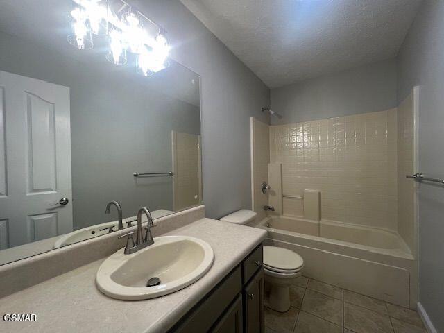 734 Southview Cir, Kodak, TN 37764 - bathroom featuring tile patterned flooring, toilet, vanity, and shower / tub combination