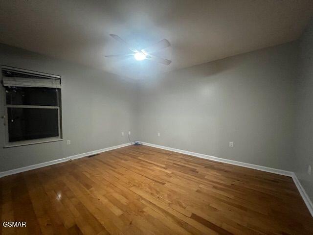 734 Southview Cir, Kodak, TN 37764 - spare room featuring wood finished floors and baseboards