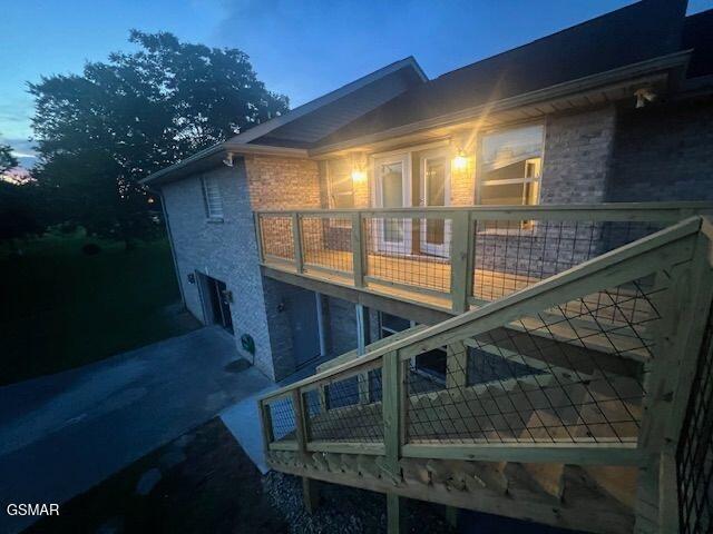734 Southview Cir, Kodak, TN 37764 - view of property exterior featuring a balcony and brick siding