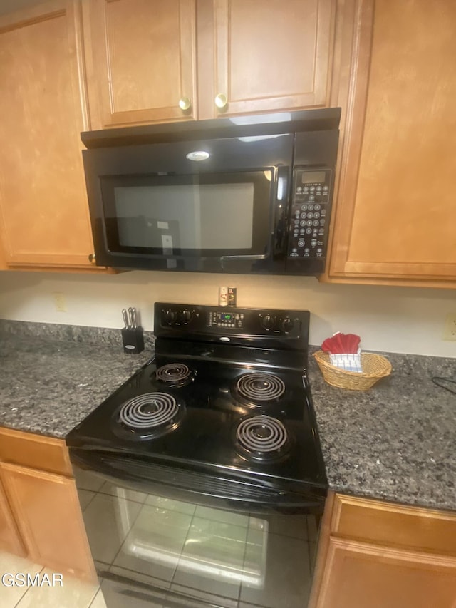 124 Plaza Dr Unit 3107, Pigeon Forge, TN 37863 - kitchen view of black appliances and dark stone countertops