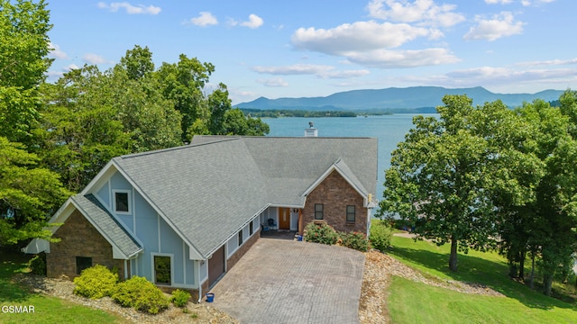 3995 Island View Way, Sevierville, TN 37876 - view of front of home with roof with shingles, driveway, stone siding, and a front lawn